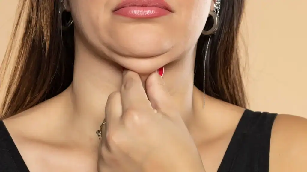 An image of a woman with double chin, sad, worried : Non Surgical Double Chin Removal Treatment in Sleaford, UK