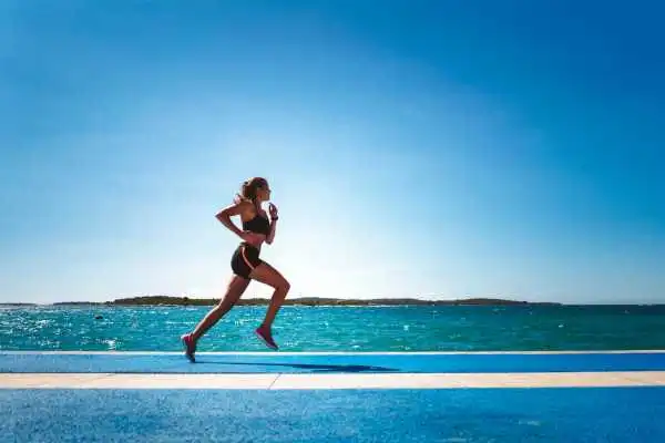 Woman running showing strong leg muscle Sleaford